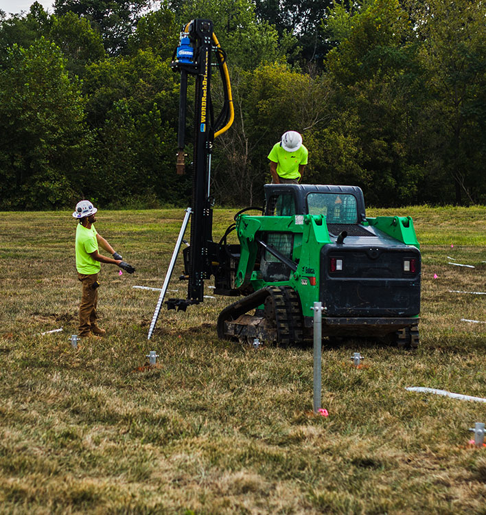 Skid Steer Attachment installing Solar Screw